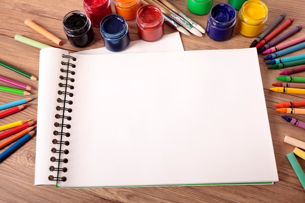 Free photo painting notebook in the table