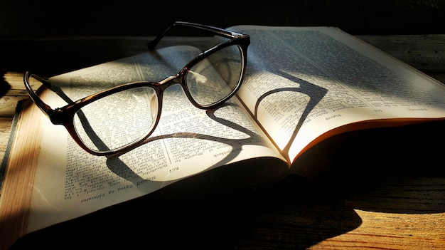 A pair of glasses and a book