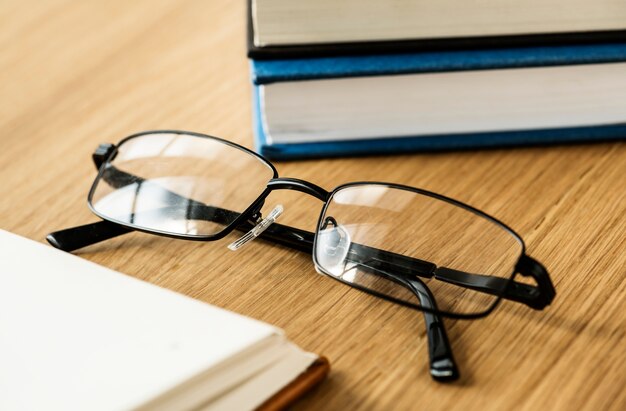 A pair of glasses and books educational, academic and literary concept