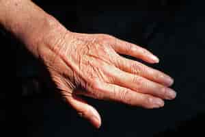 Free photo pair of wrinkled hands of an elderly chinese woman