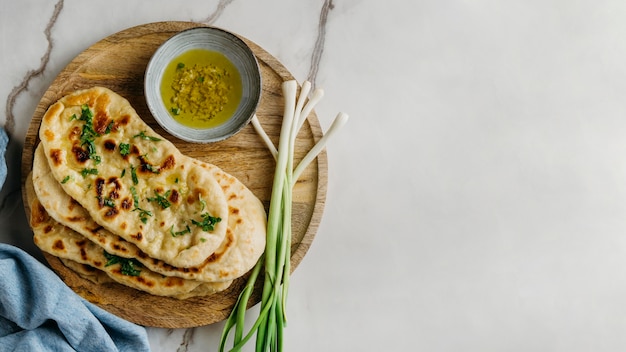 Pakistani food on wooden board with copy-space