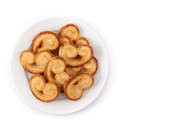 Palmier puff pastry in plate isolated on white background