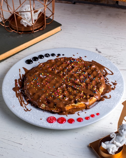 Free Photo pancake under chocolate on the table