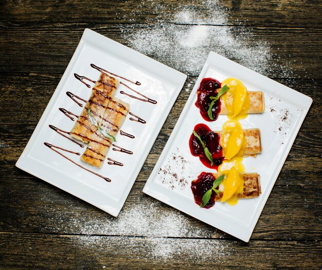 Pancakes topped with chocolate and jam