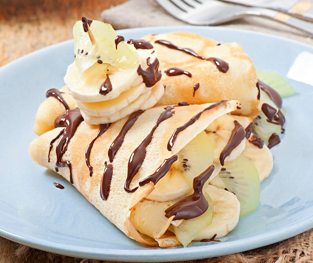 Pancakes with ice cream and chocolate sauce