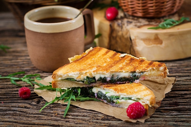 Free Photo panini sandwich with cheese and mustard leaves. morning coffee. village breakfast