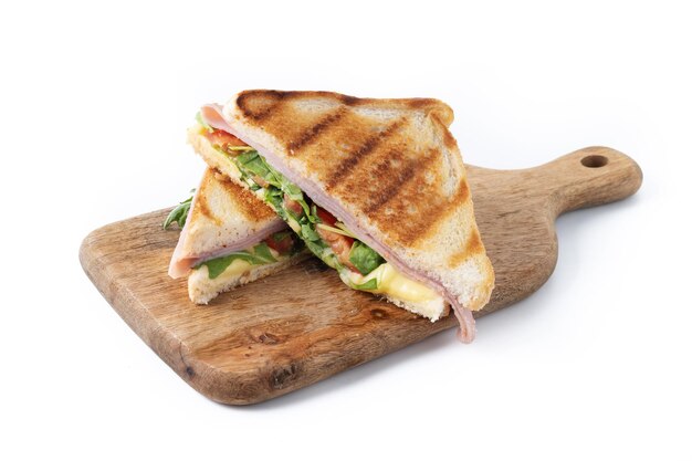 Panini sandwich with ham cheese tomato and arugula isolated on white background