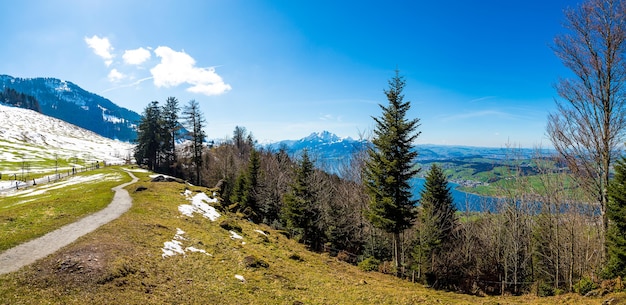 Free photo panoramic shot of the beautiful mountains under the blue sky in switzerland