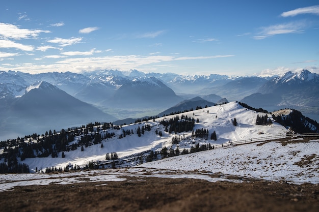 Free photo panoramic shot of the rigi mountains in arth switzerland, under a blue sky during winter