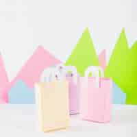 Free photo paper bags with paper mountains on table