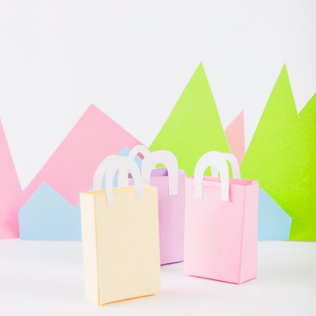 Free Photo paper bags with paper mountains on table