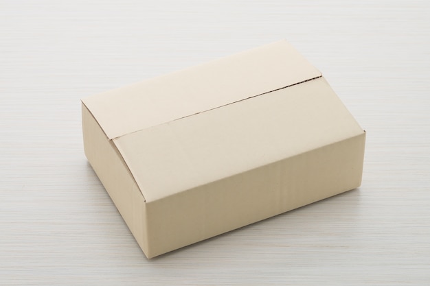 Free photo paper box on wood background