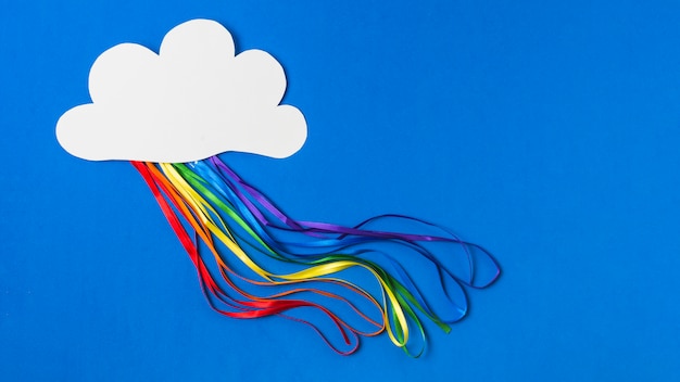 Paper cloud with bright tinsels in LGBT colors