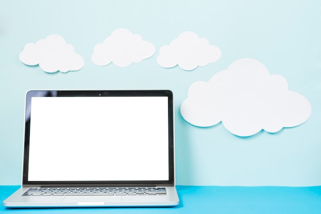 Free Photo paper clouds near laptop