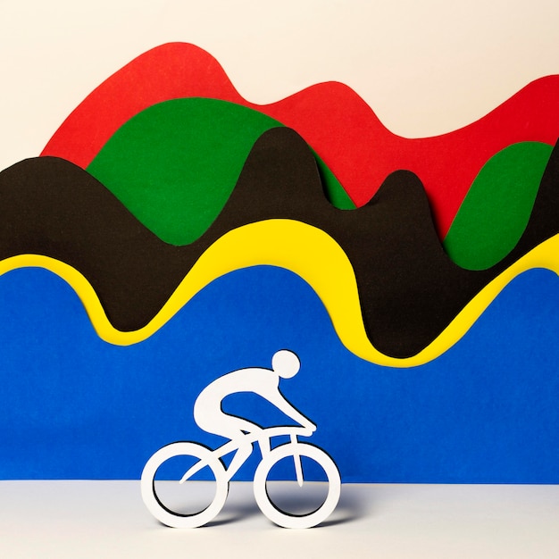 Free Photo paper cyclist with abstract colorful waves