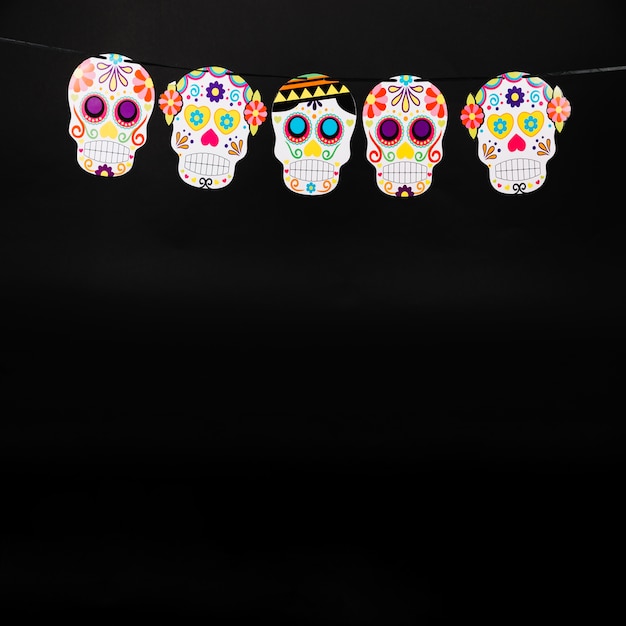 Free Photo paper garland with colorful skulls