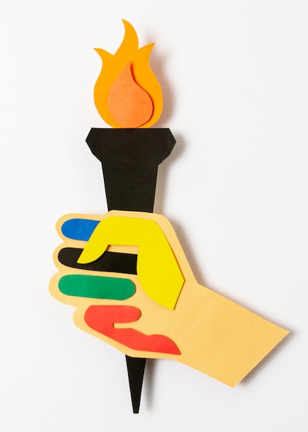 Free photo paper hand holding torch