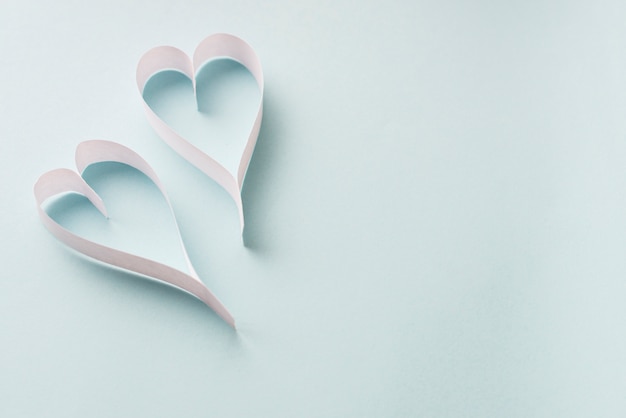 Paper hearts on light background