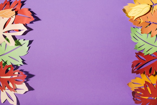 Paper leaflets on purple table