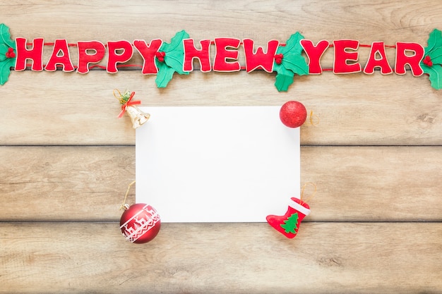 Free photo paper near happy new year inscription