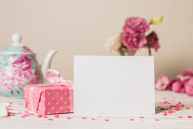 Paper near present box and teapot