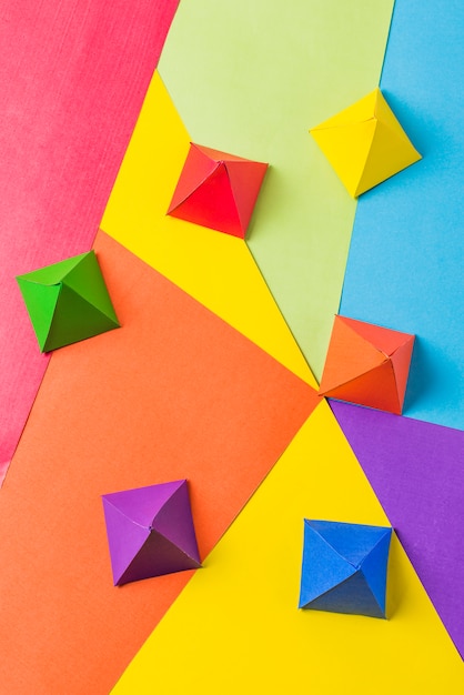 Free photo paper origami pyramids in bright lgbt colors