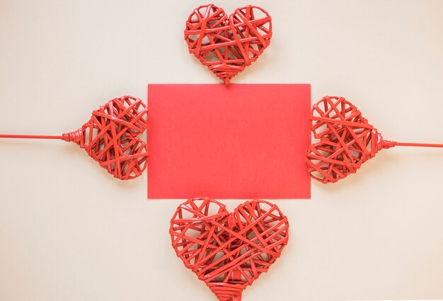 Paper between ornament hearts on wands 