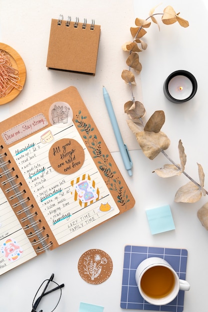 Free photo paper planner bullet journal with stationery