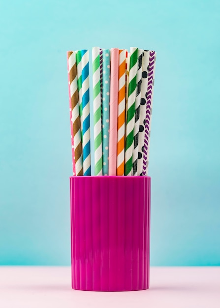 Paper straws in a cup front view