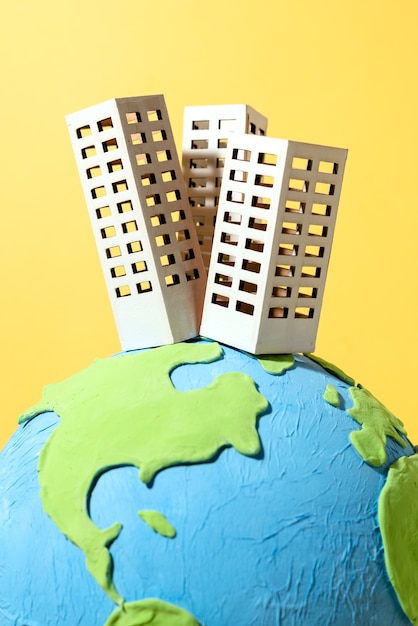 Free photo paper style earth globe with buildings