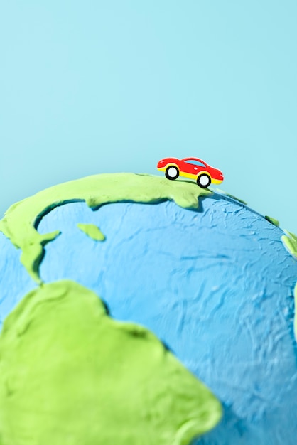 Free photo paper style earth globe with car