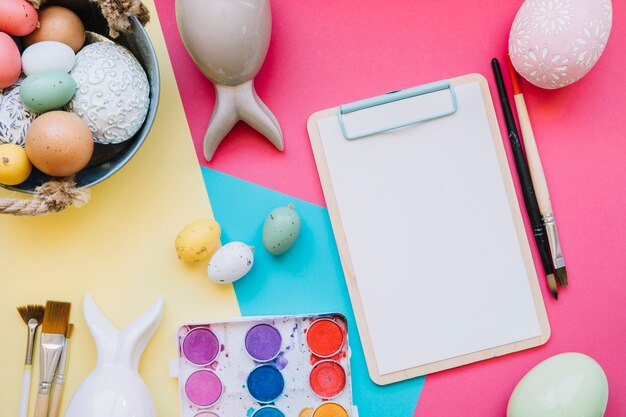 Paper tablet and different colored eggs