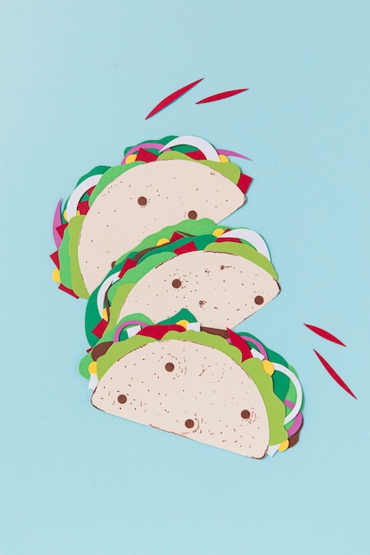 Free Photo paper tacos on blue background top view