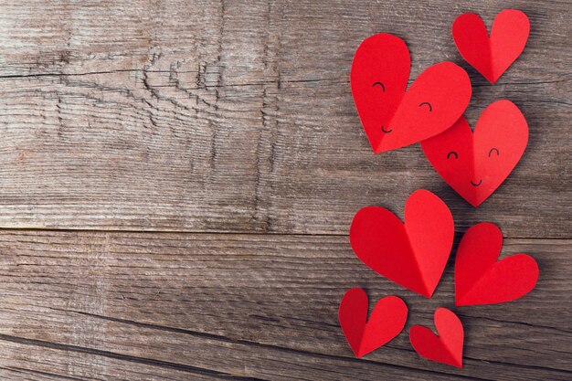 Paper valentines day hearts on wooden