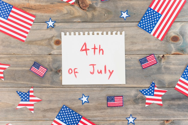 Free Photo paper with text 4th of july and many us flags