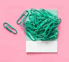 Free photo paperclips on a piece of paper