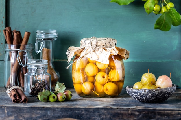 Paradise apple jam. Paradise apples in sugar syrup onn old wooden. Harvesting the autumn harvest.