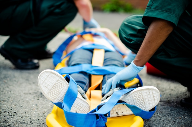 Free Photo paramedic team rescuing a young critical patient