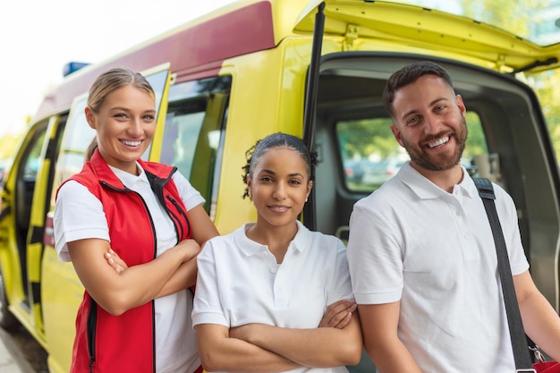 Paramedics at work with an ambulance Paramedic nurse and emergency doctor at ambulance with kit