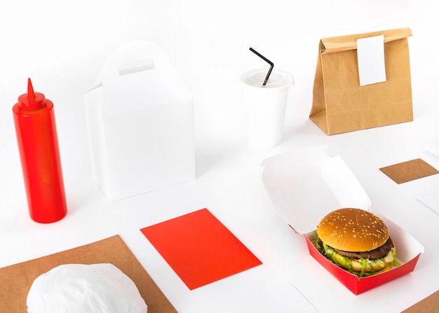 Parcel; burger; sauce and disposable cup mockup on white background