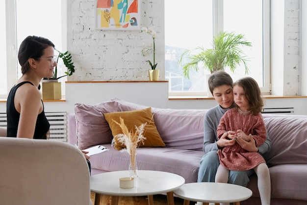 Parent and kid talking to psychologist