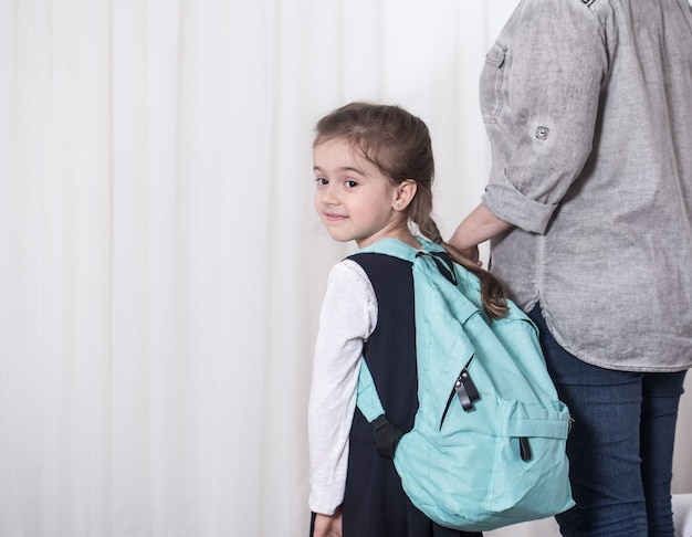 Parent and primary school student go hand in hand