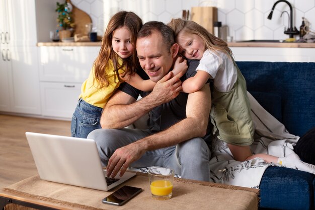 Parent trying to work from home surrounded by kids