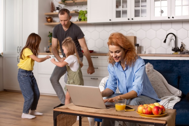 Parent trying to work from home surrounded by kids