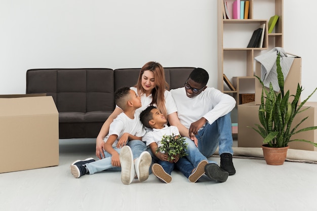 Parents and children staying together on the floor