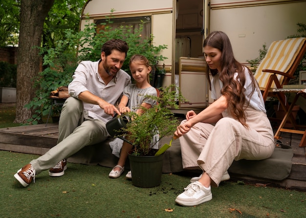 Free photo parents and daughter spending time together while wearing linen clothing