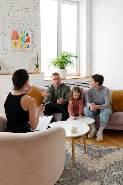 Parents and kid doing therapy