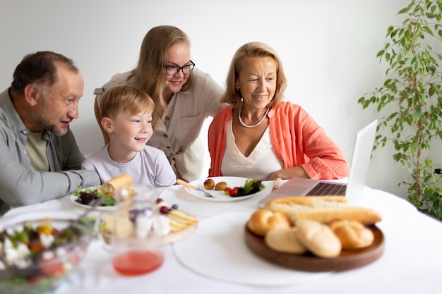 Free photo parents spending time with their daughter and grandson at home