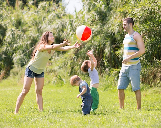 Free photo parents with children at sunny day