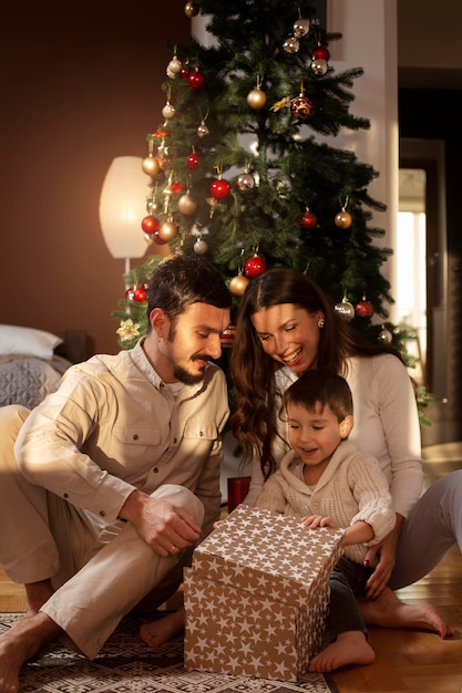 Parents with their son celebrating christmas together